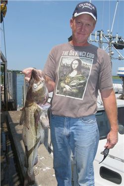 Capt. John holding cod