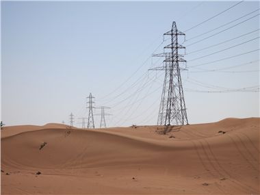 Power lines crossing dessert