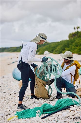 Collecting plastic from Henderson Island East Beach for removal.